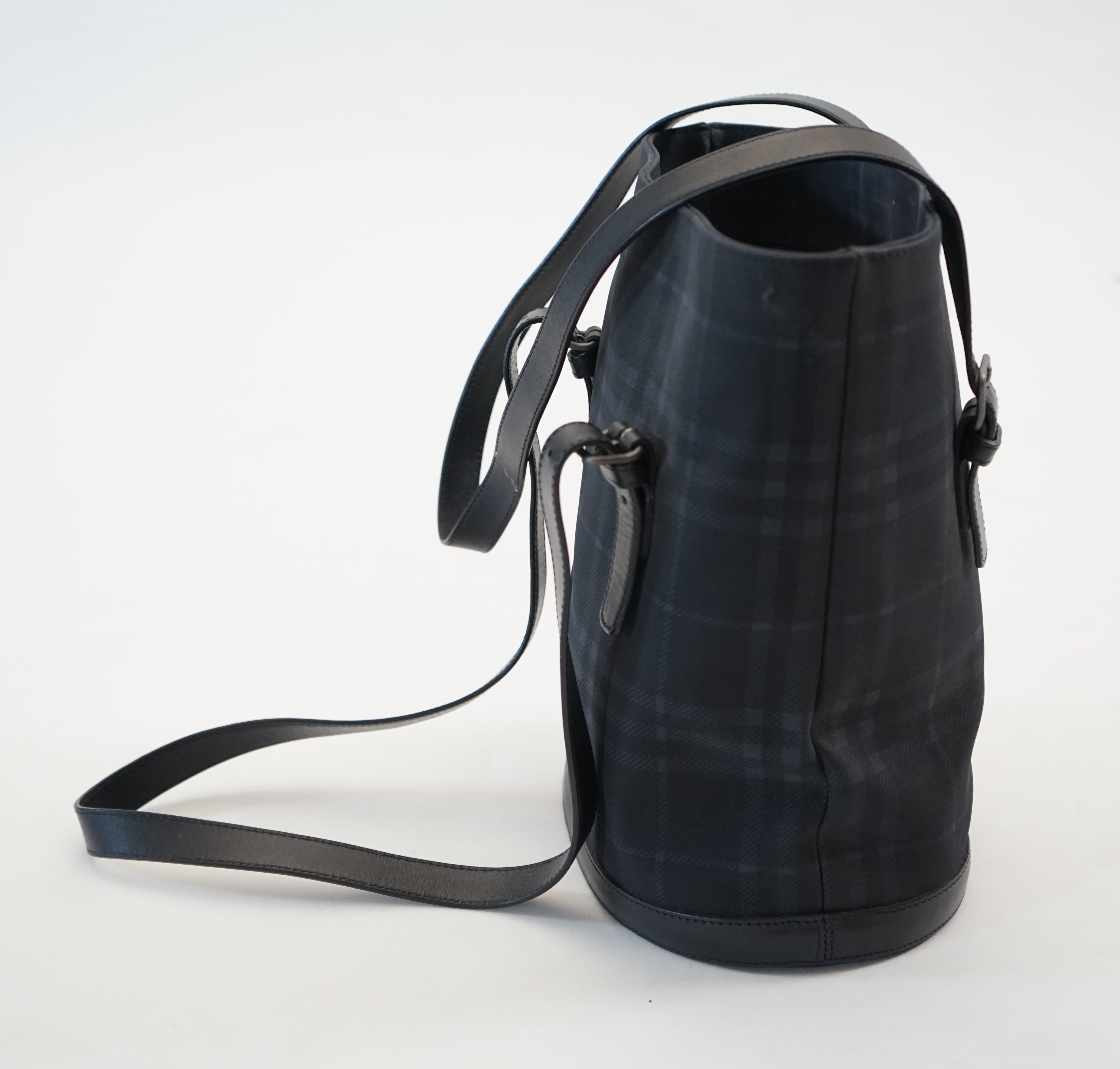 A Burberry bucket bag in blue black tartan canvas and leather, width 26cm, depth 16cm, height 27cm
